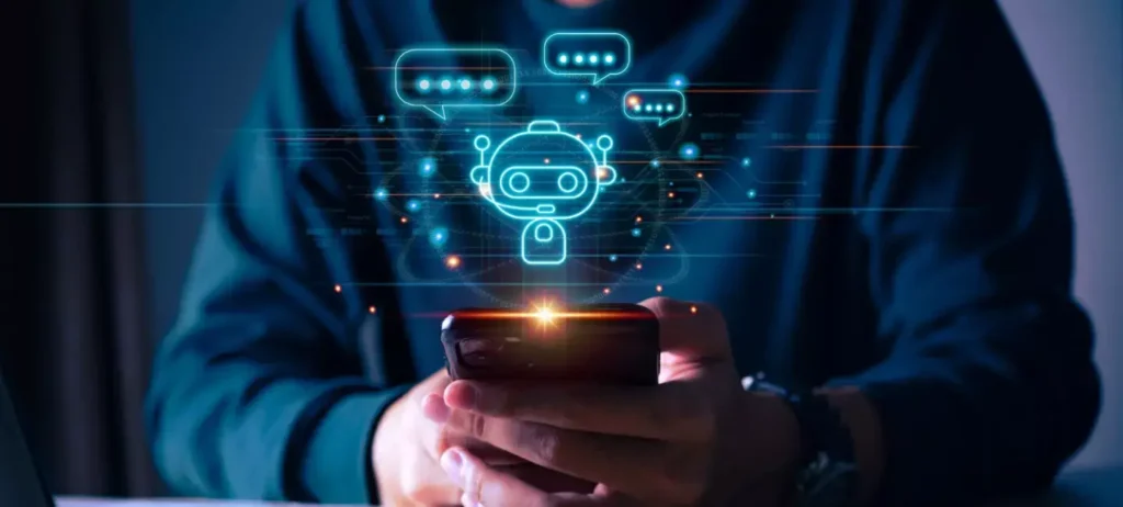 Um homem utiliza um smartphone, de onde sai uma imagem de um robô.